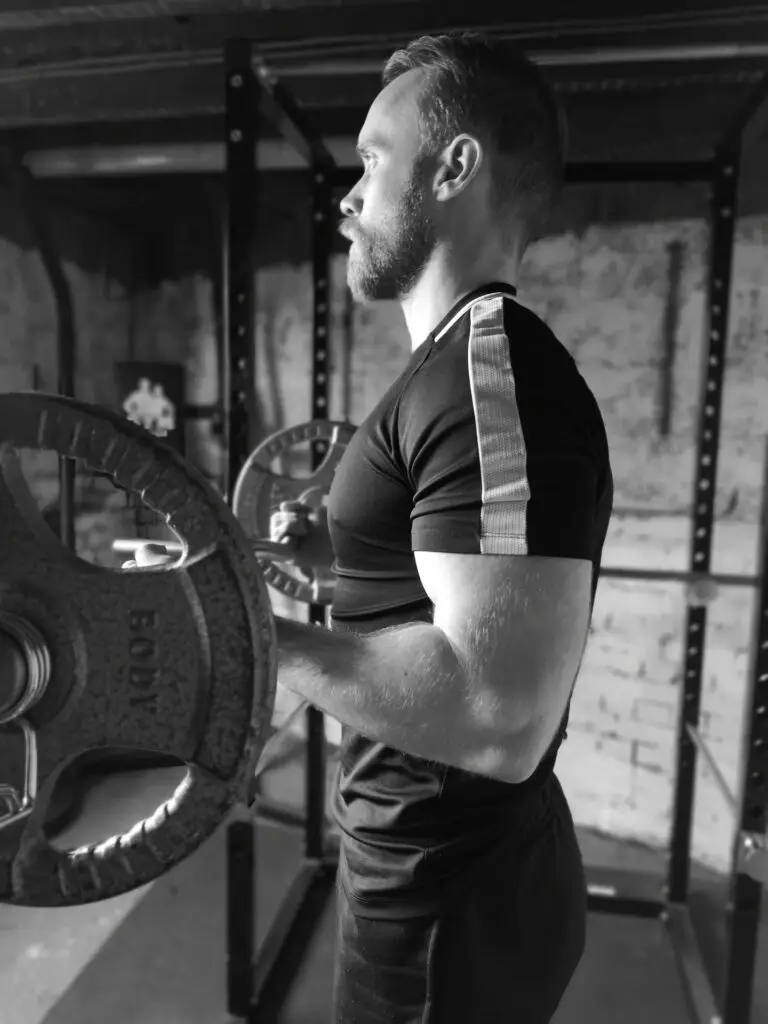 man with beard doing a bicep curl exercise