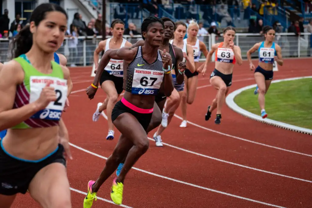 women sprinters around track