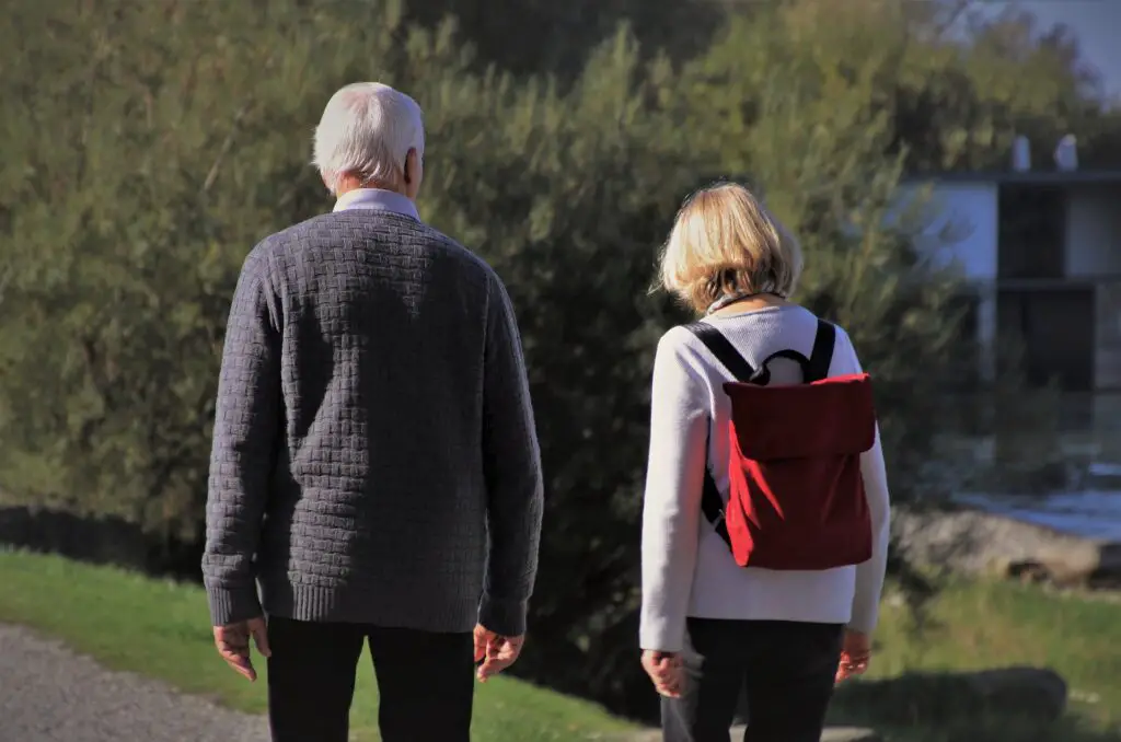 senior man and woman walking