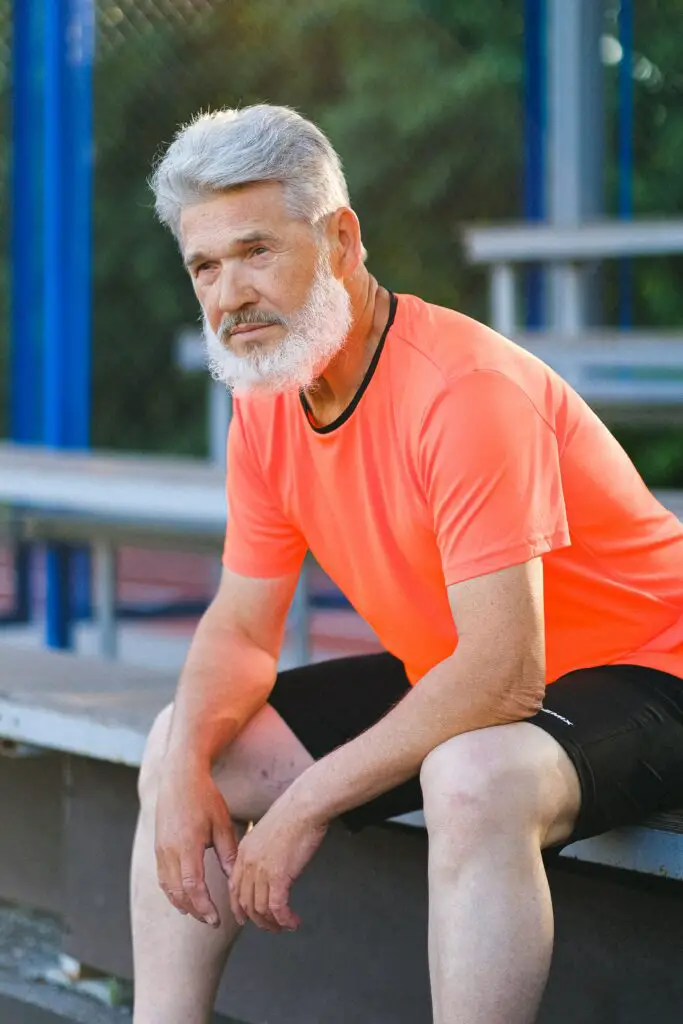 resting after a set of exercise, senior man