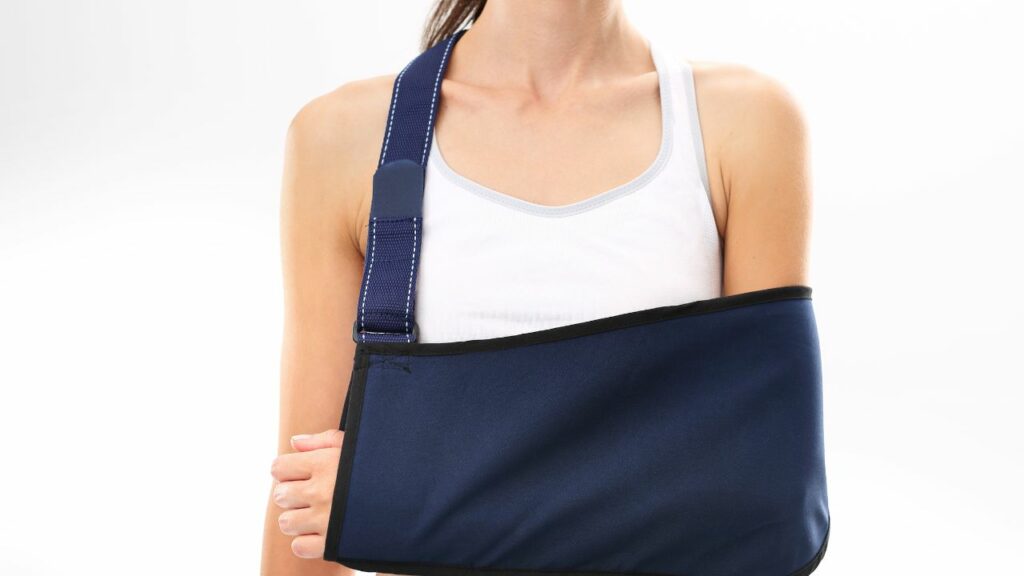 shoulder sling for rotator cuff injury on woman