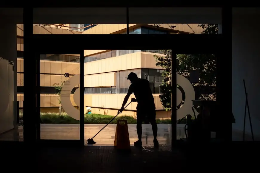 man mopping large home